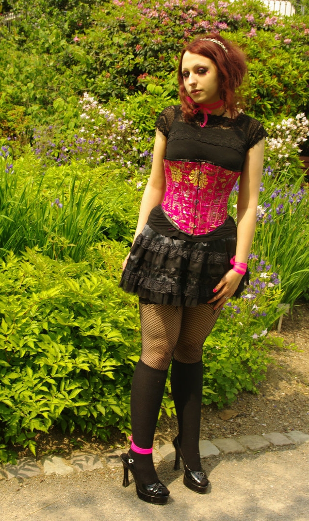 Redhead Gothic Girl wearing Black Fishnet Stockings and Black Opaque Nylon Kneehighs